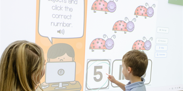 Children participating in an interactive SMART Board lesson at Gateway Preschool